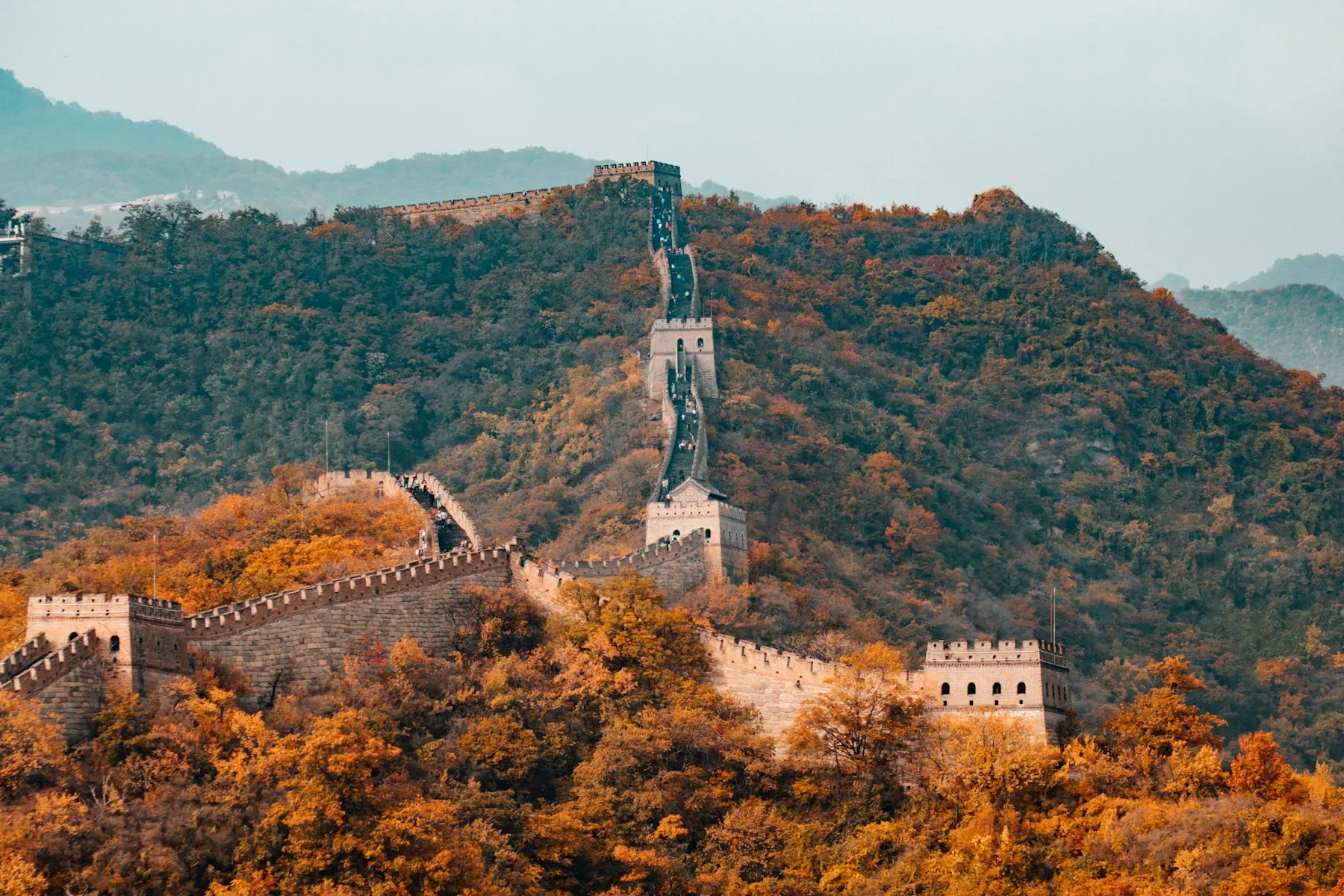 The Great Wall tracing a mountain ridgeline in autumn